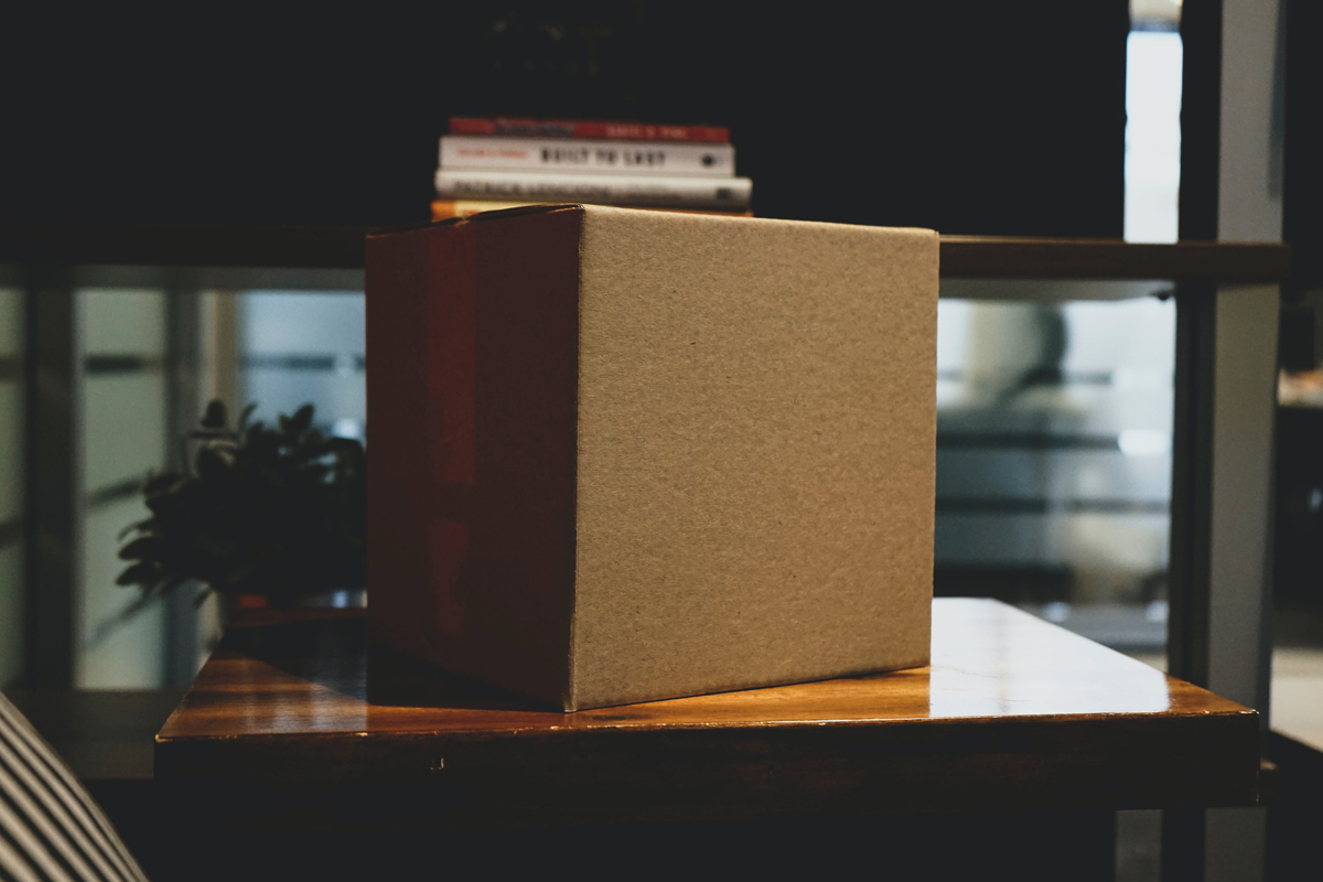 A delivered parcel left on a table in a waiting room