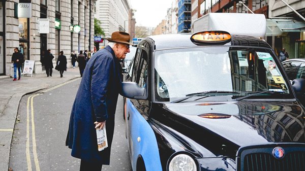 Man-catching-taxi.jpg An elderly man speaking to a taxi driver to ask for a lift
