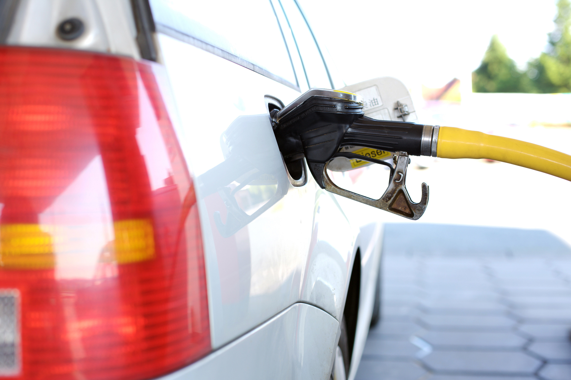 A car filling up with diesel at a fuel station