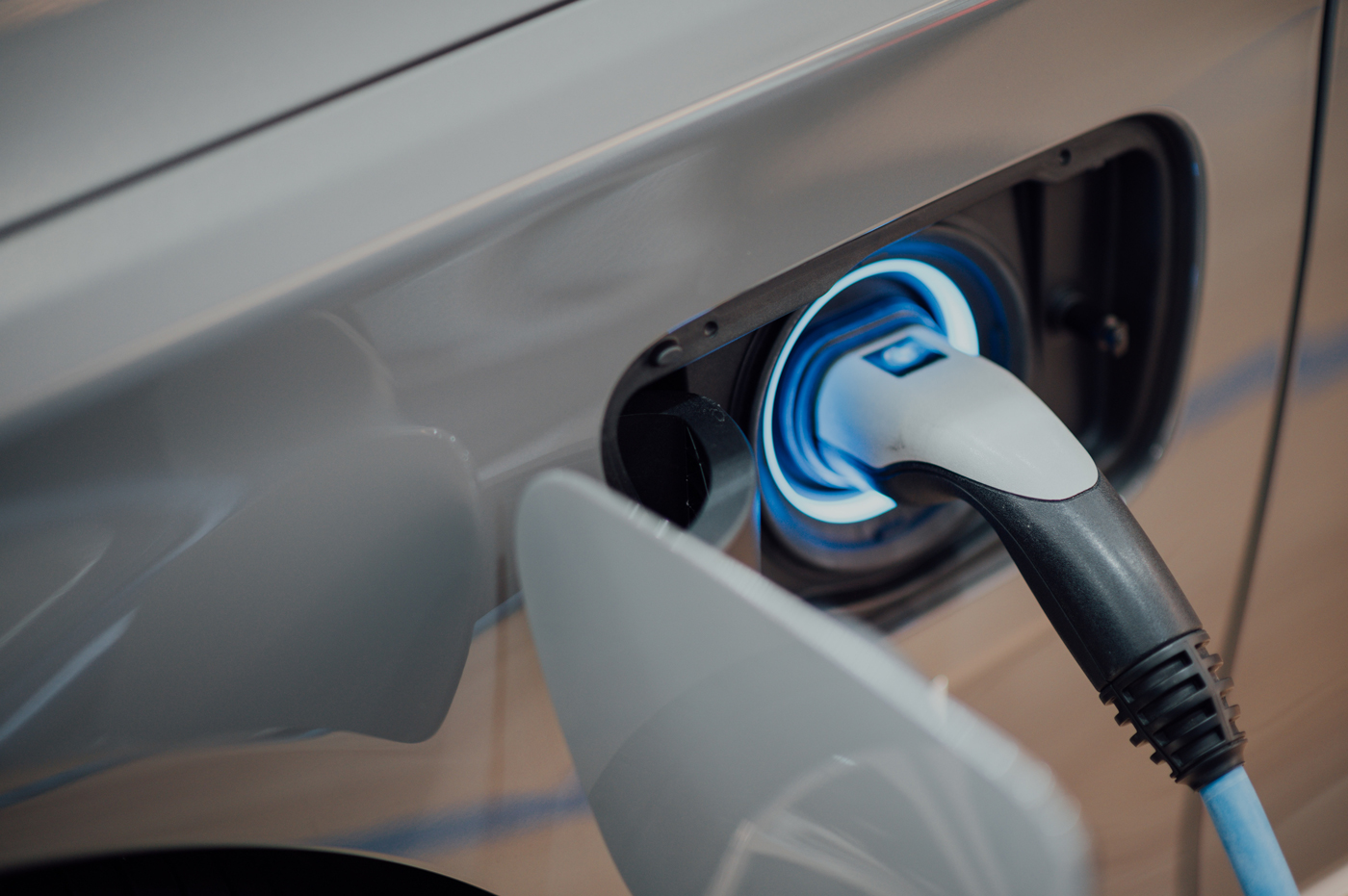 An electric car plugged in to a charger